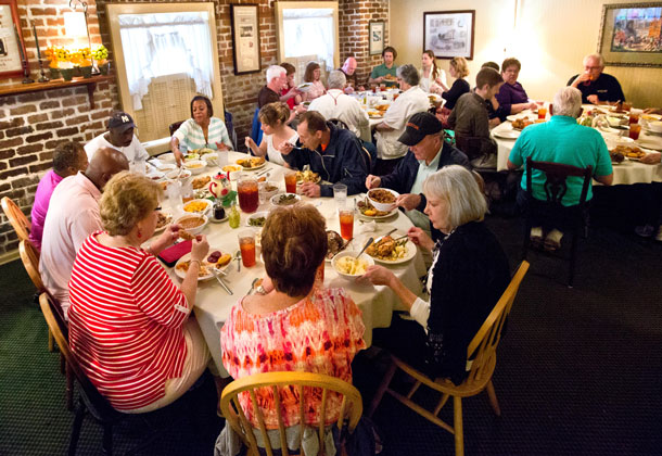 A crowded table of Southern dishes at Mrs. Wilkes Dining Room