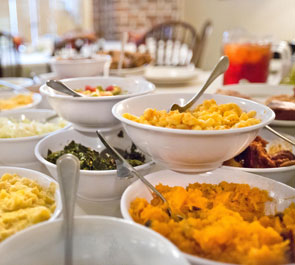 Guests seated around a shared table at Mrs. Wilkes Dining Room